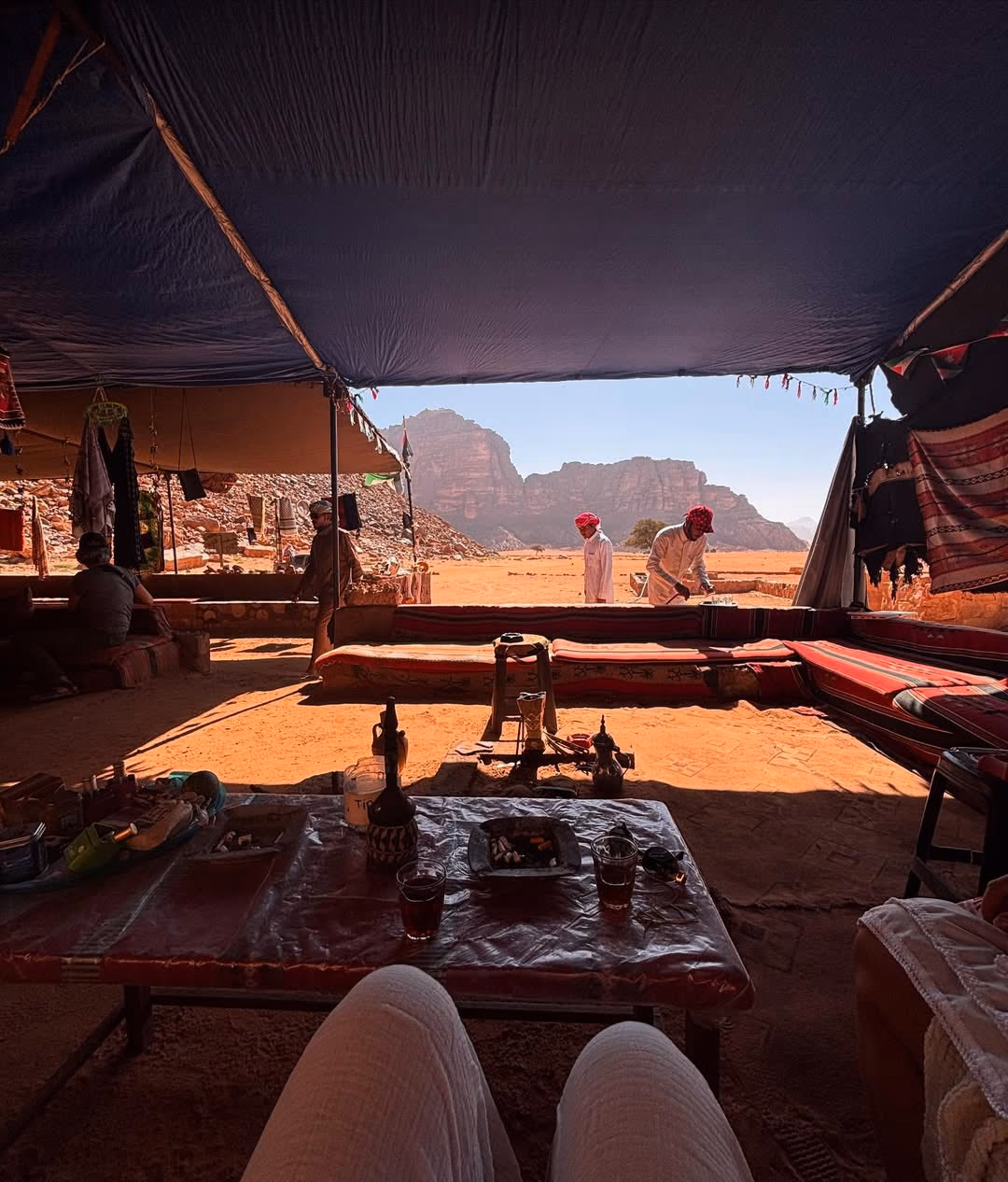 Wadi Rum desert landscape with towering sandstone mountains and red sand dunes